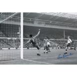 Autographed George Eastham 12 X 8 Photo : B/W, Depicting Brazilian Goalkeeper Gilmar Saving A
