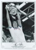 Football. Billy Bonds Signed 16x12 black and white photo with claret and blue around edges of shirt.