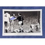 Football. Nobby Stiles Signed 18x12 black and white photo. Photo shows Stiles picking a fight with