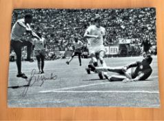 Football, Jairzinho signed 12x16 black and white photograph pictured during the 1970 World Cup match