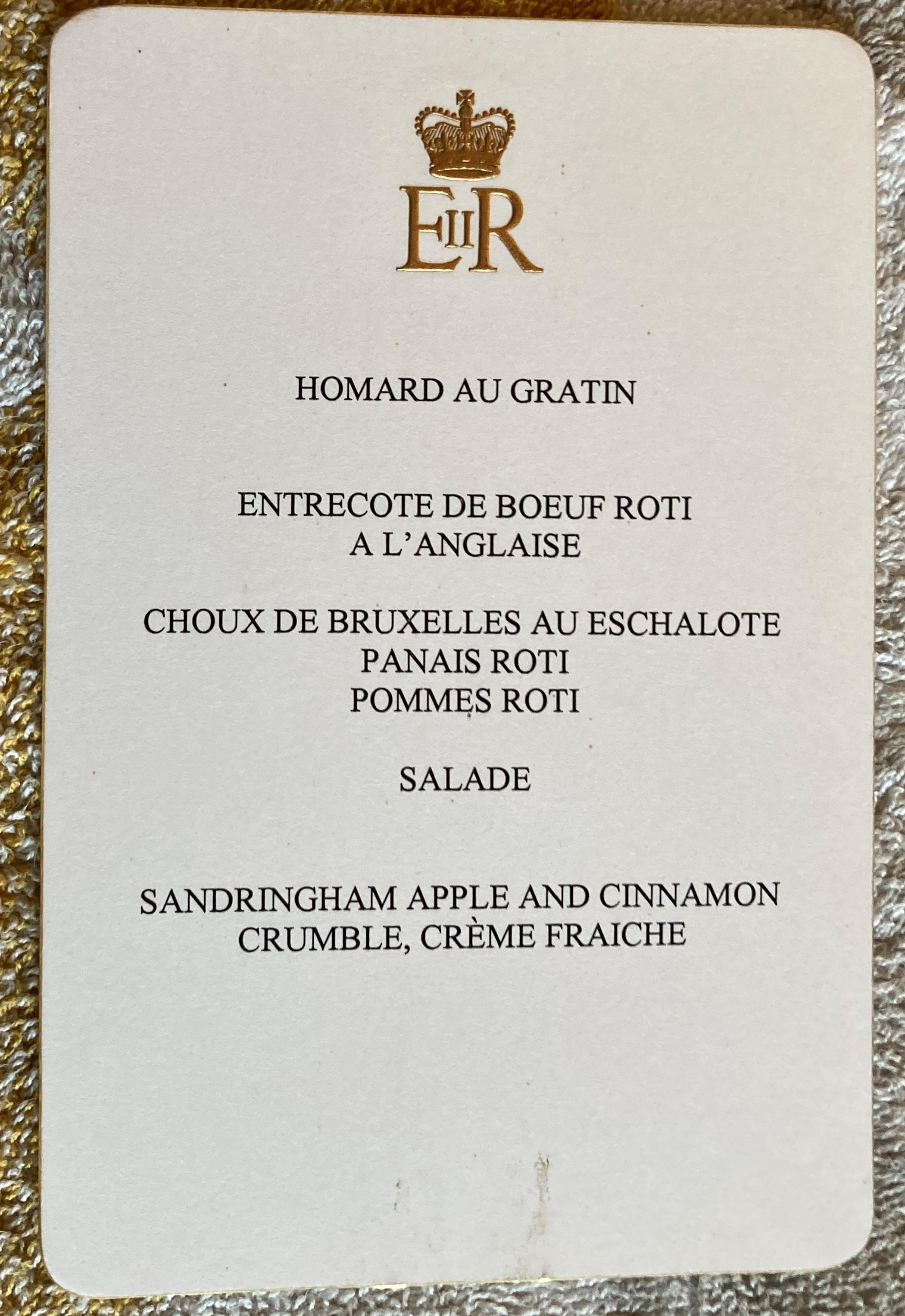 Queen Elizabeth II Sandringham house dinner menu with raised embossed gold logo from collection of