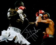 Johnny Nelson signed 10x8 colour photo pictured during one of his World Title fights. Ivanson