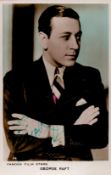 George Raft Signed 5 x 3 inch approx Colourised Photo. Signed in green ink. Good Condition. All