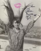 007 Bond actress Caroline Munro signed and kissed 8x10 photo. Good Condition. All autographs come