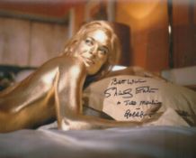 Shirley Eaton signed 10 x 8 inch on bed covered in Gold from James Bond Movie Goldfinger. She has