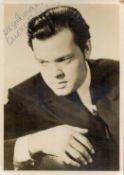 Orson Welles Signed 7x5 inch Vintage Black and White Photo. Signed in blue ink. Fair condition. Est.