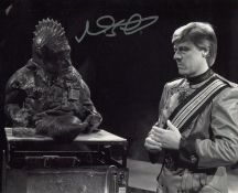 Doctor Who Sil 8x10 scene photo signed by actor Nabil Shaban. Good Condition. All autographs come