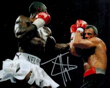 Boxing Star Johnny Nelson Signed 10x8 inch Colour In Action Photo. Good condition. All autographs