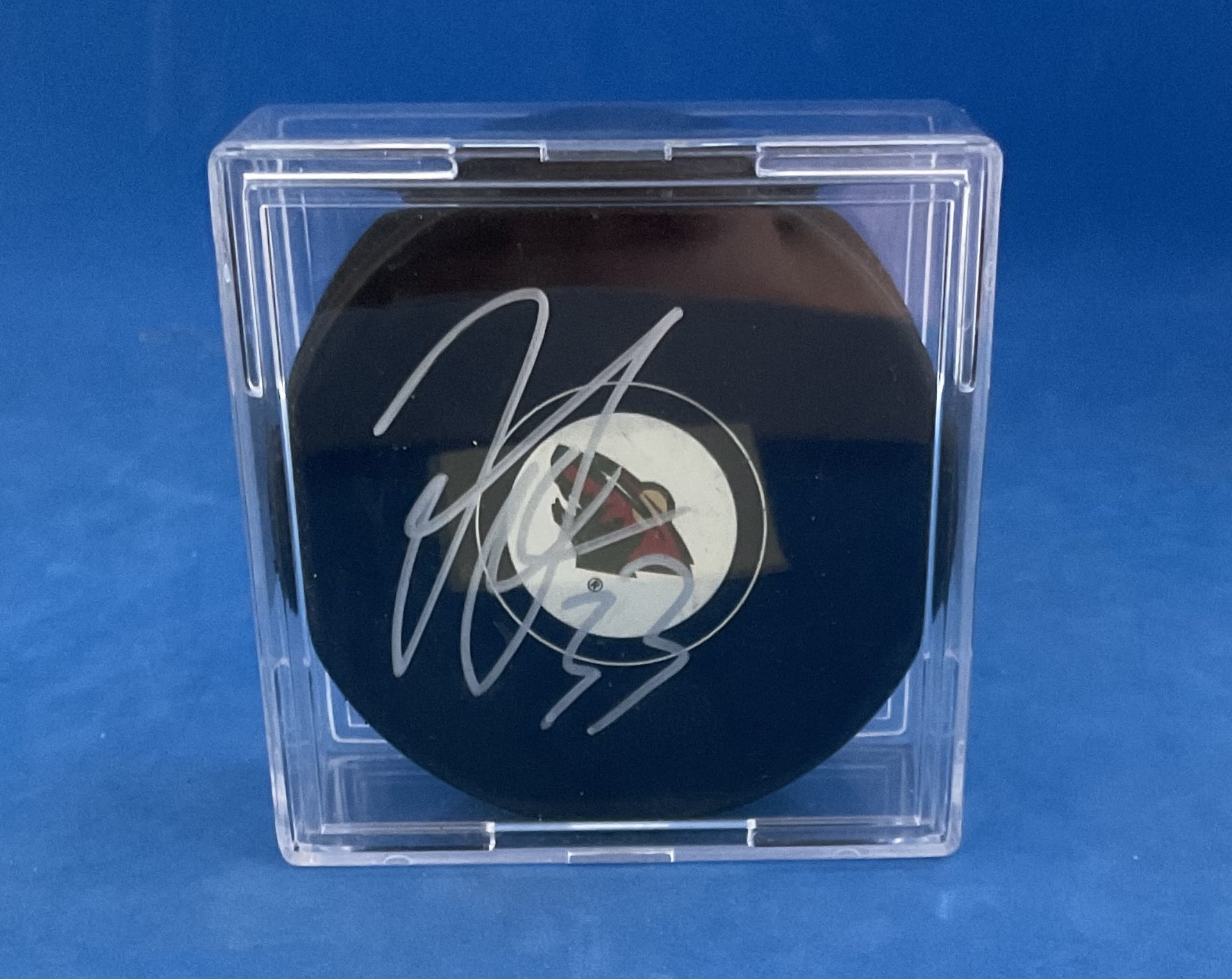 American Ice Hockey Defender Jordan Leopold Signed Official NHL Puck. Signed in silver ink. Housed