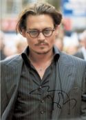 Johnny Depp signed 12x8 colour photo. Good condition. All autographs come with a Certificate of