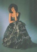 Shirley Bassey Signed 8x6 Inch Colour Printed Photo of Bassey in a Glamourous Dress. Good condition.