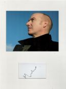 Midge Ure autograph mounted display. Mounted with a photograph to approx. 16 x 12 inches overall.