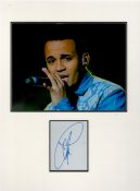 Aston Merrygold (JLS) signature piece in autograph presentation. Mounted with photograph to