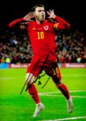 Football Aaron Ramsey signed Wales 12x8 colour photo. Good Condition. All autographs come with a