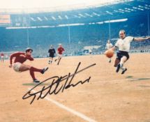 Football. Geoff Hurst Signed 10x8 colour photo. Photo shows the Hurst Shooting for goal against West