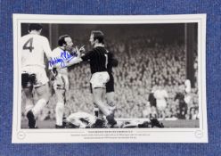 Football. Nobby Stiles Signed 18x12 black and white photo. Photo shows Stiles picking a fight with