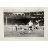 Football Geoff Hurst signed 20x14 black and white print They Think Its All Over pictured scoring his