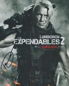 Dolph Lundgren signed Expendables 2 colour promo photo. Good condition. All autographs come with a