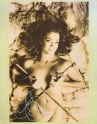 Claudia Christian signed 14x11 black and white photo. Good condition. All autographs come with a