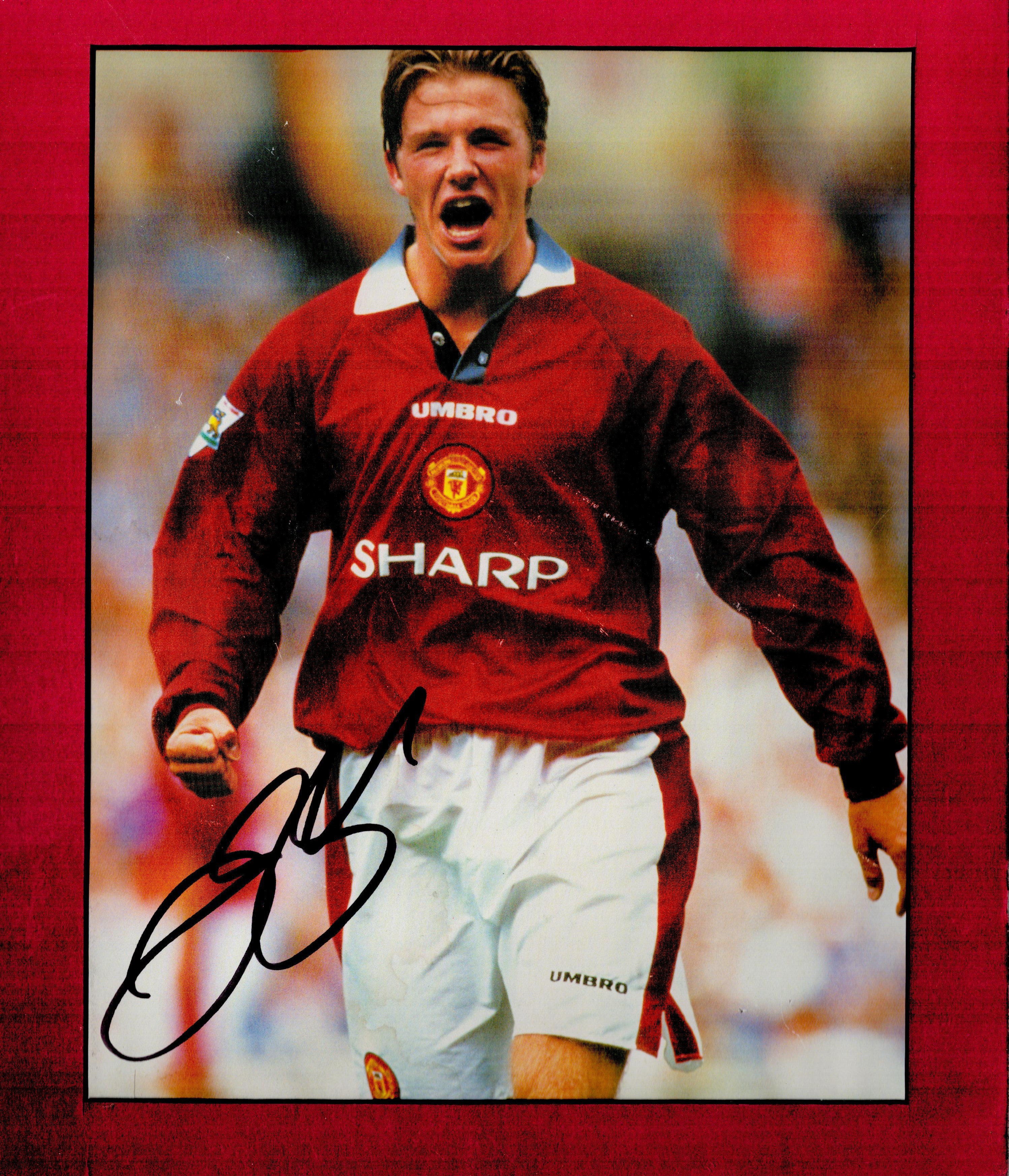 David Beckham signed 12x10 overall Manchester United mounted colour magazine photo. Good