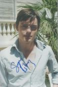 Sam Riley signed 12x8 colour photo. English actor and singer. Good Condition. All autographs come