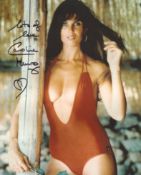 007 Bond actress Caroline Munro signed sexy pose red swimsuit 8x10 photo. Good Condition. All