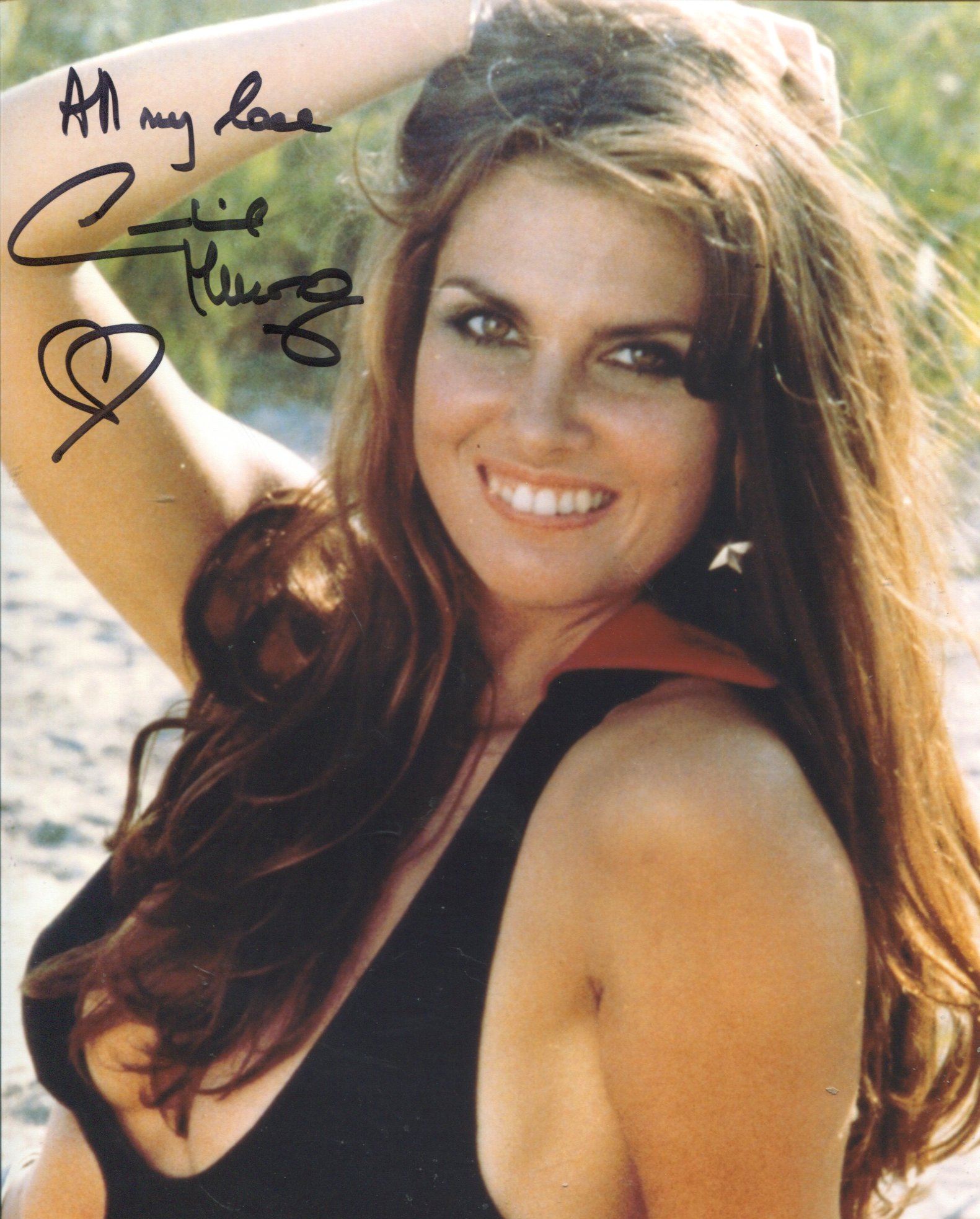 007 Bond actress Caroline Munro signed sexy pose 8x10 photo. Good Condition. All autographs come