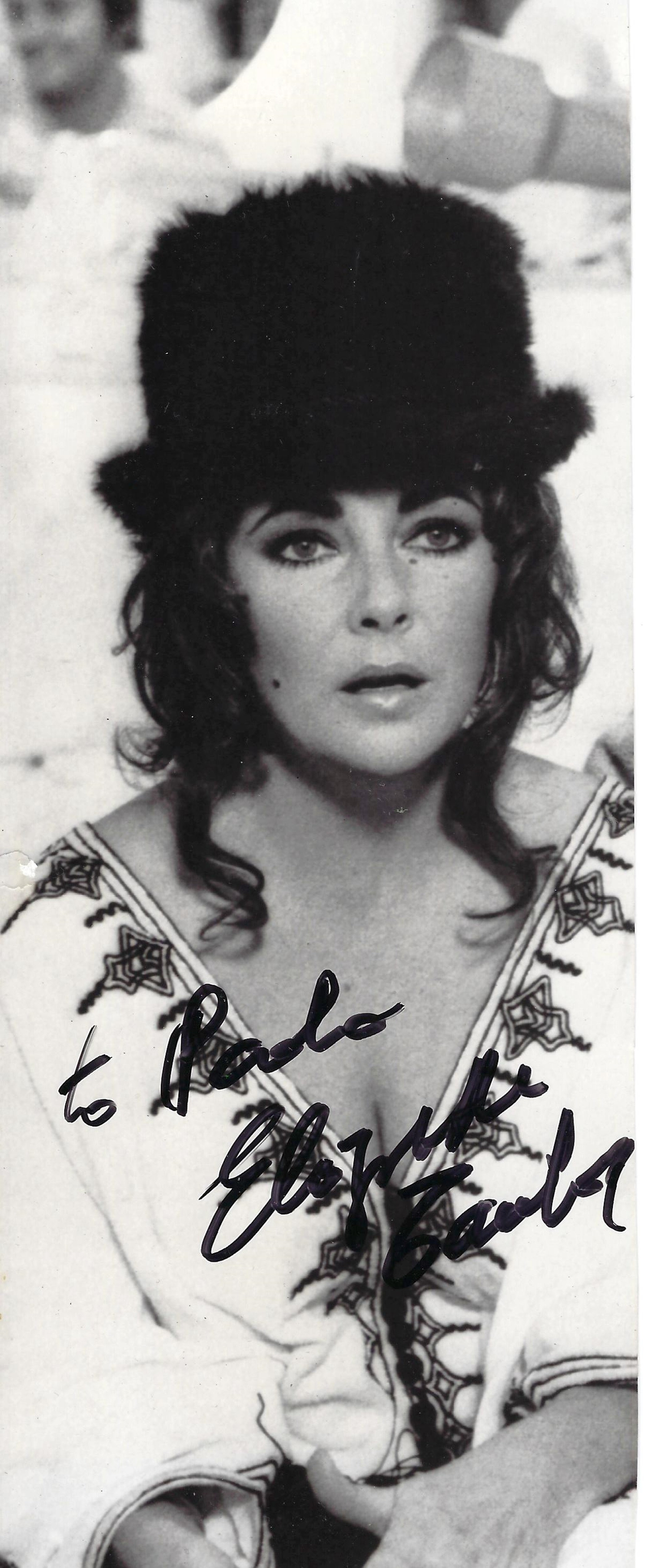 Elizabeth Taylor signed 10x4 black and white photograph dedicated and signed in black marker pen.