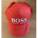 Rory McIlroy and Tommy Fleetwood signed orange Hugo Boss BMW Championship baseball cap. Good