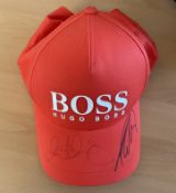 Rory McIlroy and Tommy Fleetwood signed orange Hugo Boss BMW Championship baseball cap. Good