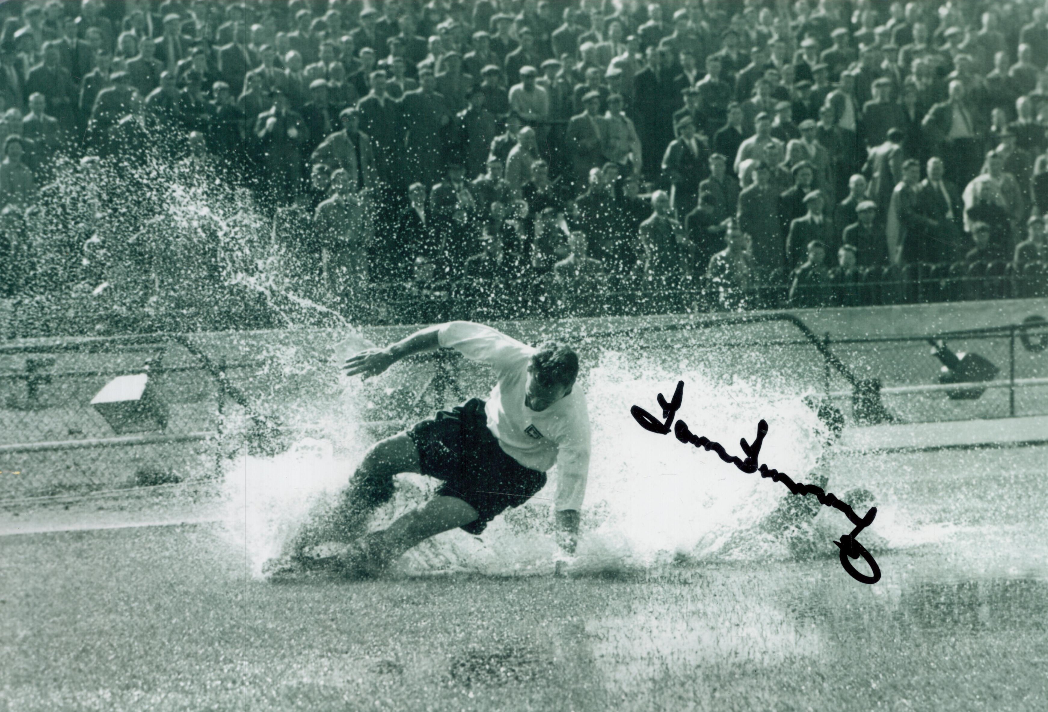 Sir Tom Finney Signed 12x8 inch Black and White Iconic Splashdown Photo. Signed in black ink. Good