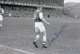 Autographed John Barnwell 12 X 8 Photo : B/W, Depicting Arsenal Wing Half John Barnwell Warming Up