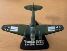 Die-Cast Model Airplane on a Stand (unknown not the Focke Wulf) good conditionWe combine postage