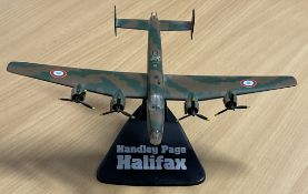 Handley Page Halifax Die-Cast Model with Stand in good conditionWe combine postage on multiple