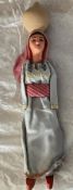 A Large Collectors Doll (approx 12 inches tall) with wooden shoes carrying a terracotta pot on her