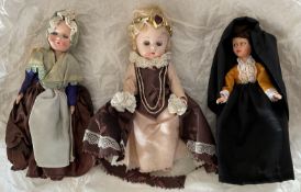 3 x Collectors Dolls, a group of three dolls the doll wearing a black dress has eyes that close when