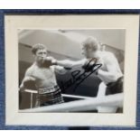 Boxer Ken Buchanan Signed Black and White Photo Showing Ken Buchanan Taking A Punch To His Chin.