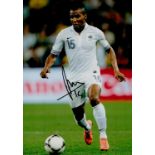 Florent Malouda signed 12x8 colour photo pictured in action for France. Good Condition All