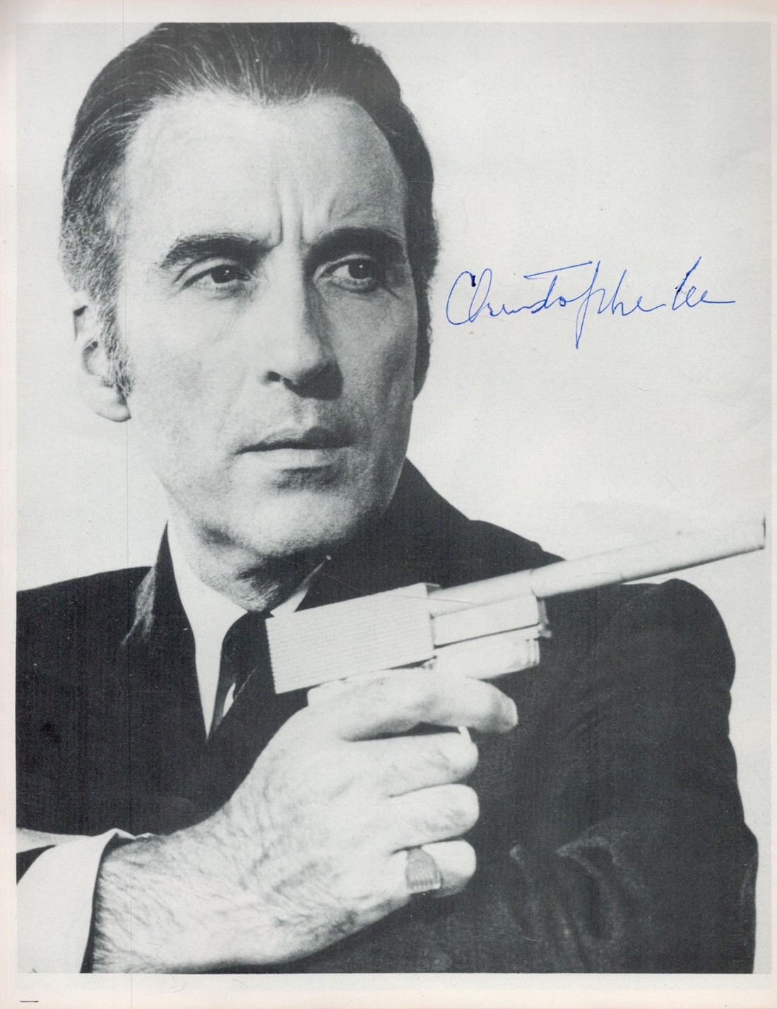Christopher Lee signed 10x8 Man With The Golden Gun black and white magazine photo. Good
