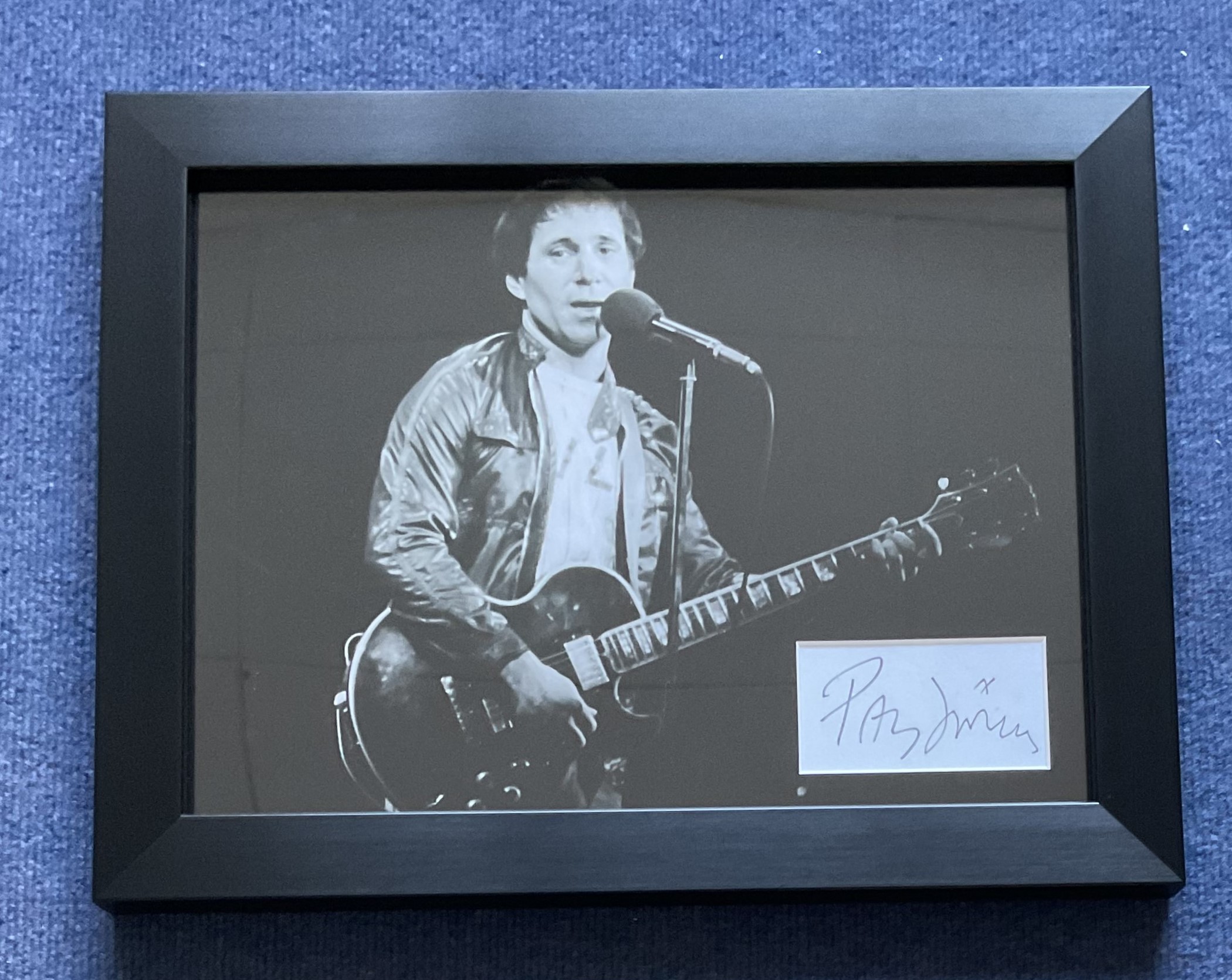 Paul Simon Signed Signature Card, Mounted with Blown Up Photo of Simon Performing, Then Framed to an