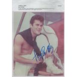 Tony Curtis signed 10x8 inches colour photo picturing as young Curtis on board a boat signed lower