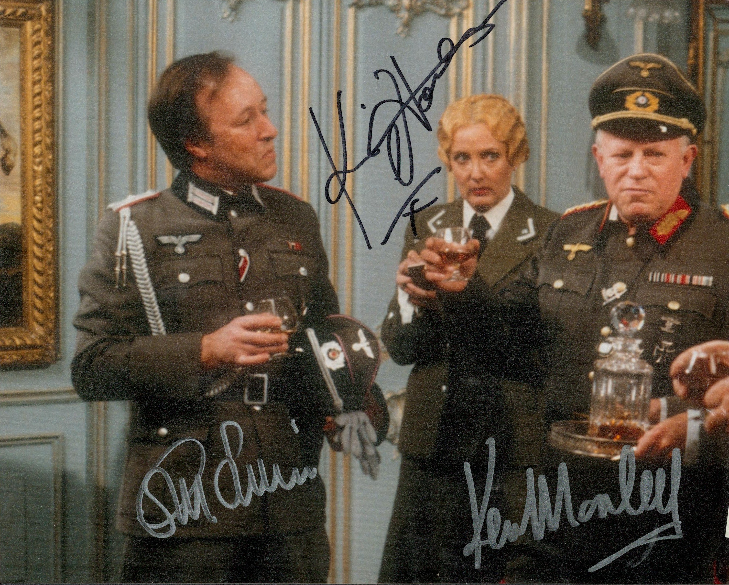 Ken Morley, Guy Siner and Kim Hartmann signed 10x8IN colour photo. Good condition. All autographed