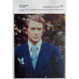 Michael Caine signed 10x8 inches colour photo picture wearing a royal blue suit signed in blue