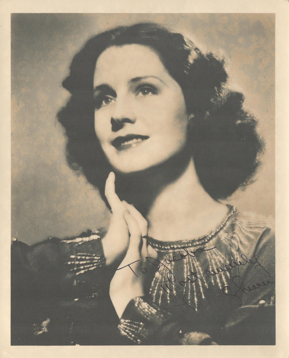 Norma Shearer signed 10x8 black and white photo with original mailing envelope dated 1937. Good