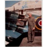 Neil Armstrong signed 10x8 original colour photo standing in flight suit next to WW2 fighter. Neil