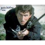 James Bond. Frederick Warder (The Living Daylights) Signed 10 x 8 inch Colour James Bond Photo. Good