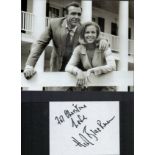 James Bond. Honour Blackman Signed Signature Card. Dedicated. Image of Blackman and Roger Moore