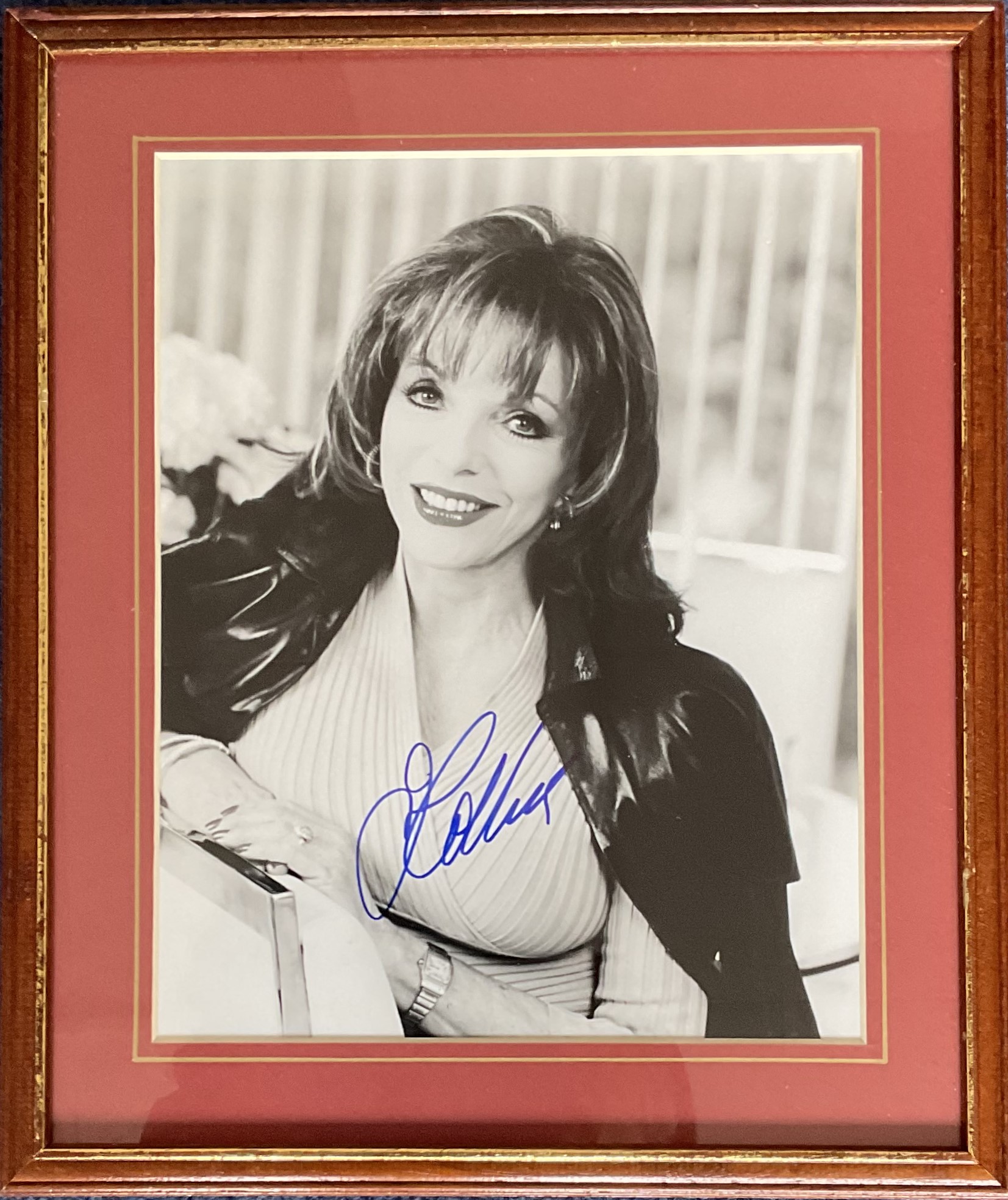 Tv and Film. Joan Collins Signed 10 x 8 inch Black and White Glossy photo in blue ink, Framed to