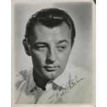 Robert Mitchum signed 10x8 black and white vintage photo. Good condition. All autographs are genuine