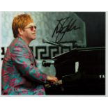 Elton John signed 10x8 inch colour photo. Good condition. All autographs are genuine hand signed and